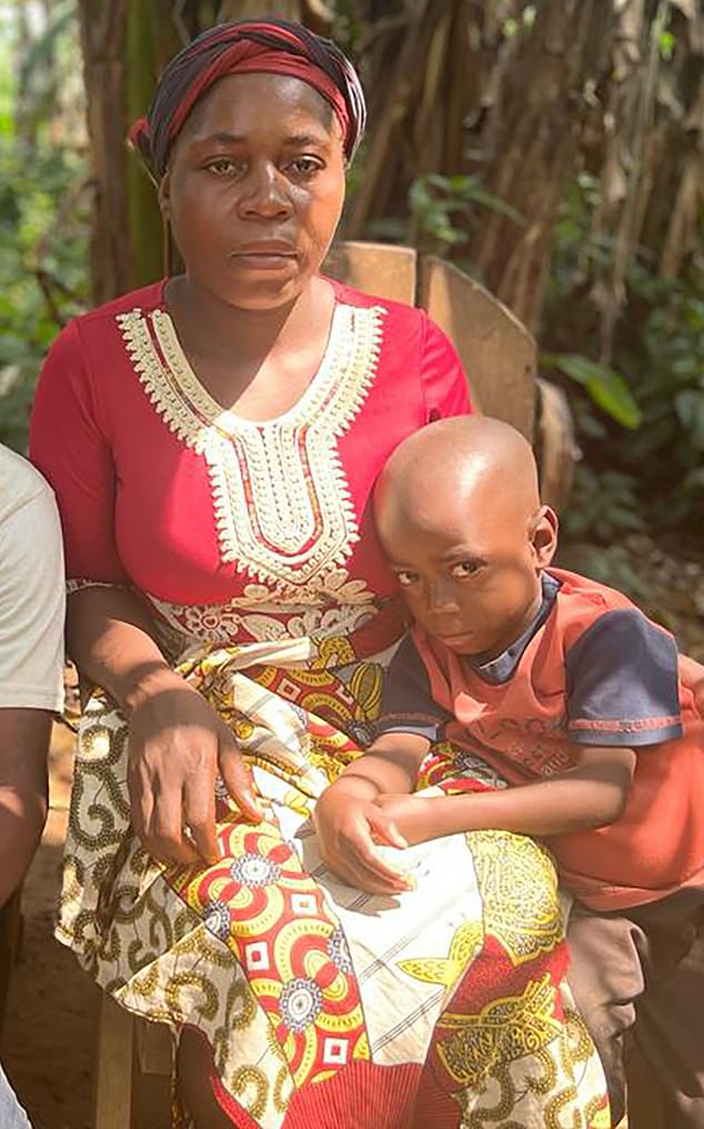 Ella Ene with son Daniel. She told the Mail on Sunday how she was allegedly raped by an African Parks guard while clinging to her baby