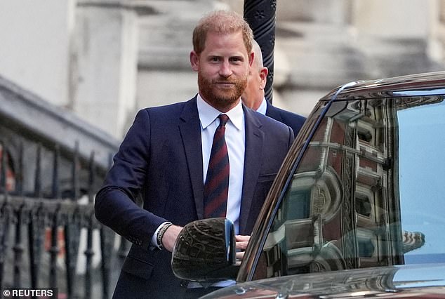 Prince Harry - pictured leaving the High Court - said it is 'impossible' to bring Meghan Markle and his children back to the UK after losing a legal challenge