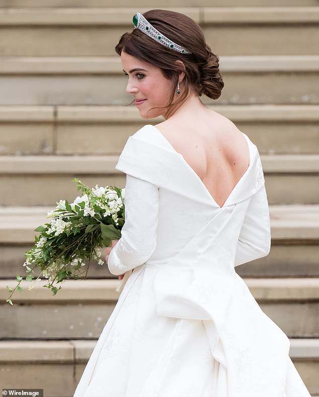 Princess Eugenie (pictured on her wedding day) has opened up about the 'sense of shame' she felt when she first saw her scoliosis scar - and revealed how she 'trained her brain' to think it was a 'cool thing' instead