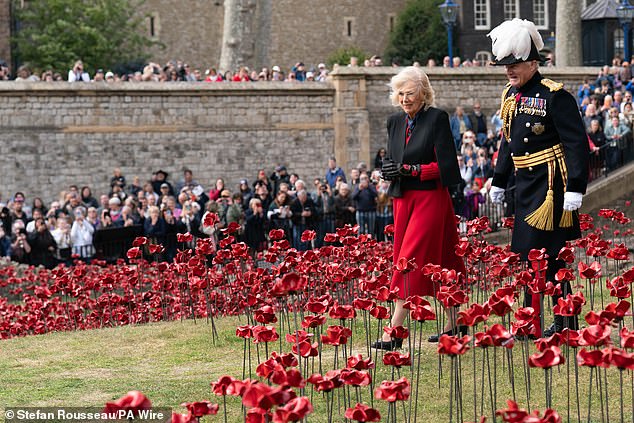 Queen Camilla views the display of ceramic poppies for the 80th anniversary of the end of the Second World War, at the Tower of London