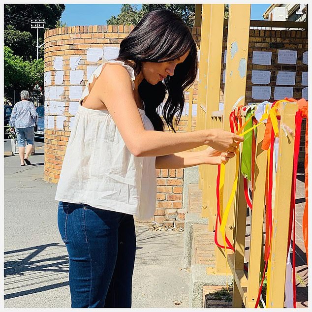 In 2019 when the Duke & Duchess of Sussex visited Cape Town the story of local student Uyinene Mrwetyana, 19, who was raped and murdered led to huge demonstations. Meghan released a photo on Instagram of her tying a yellow ribbon with a private message to the victim amongst the sea of ribbons that already festooned the post office which became a shrine