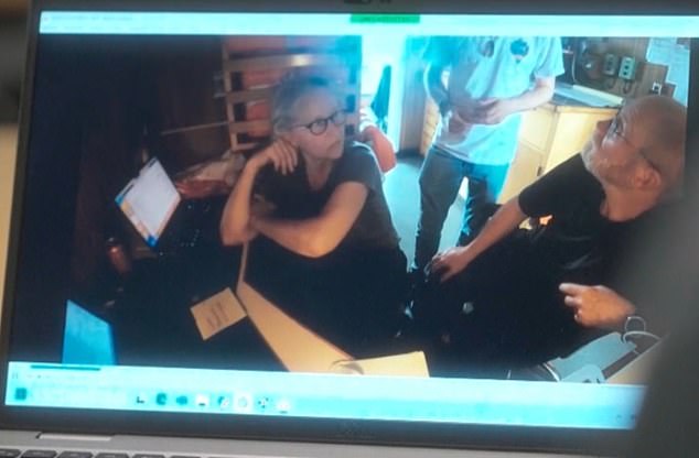 Ms Rush turns a team member sitting behind her and asks 'what was that bang?'