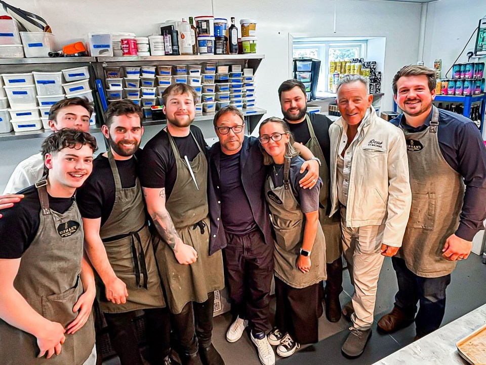 Stephen Graham and Bruce Springsteen with restaurant staff.