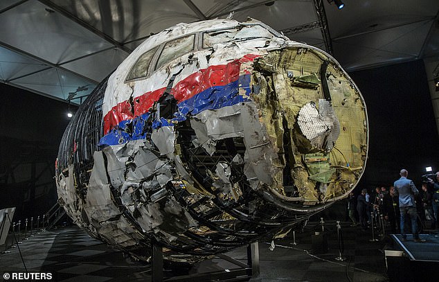 The reconstructed wreckage of the MH17 airplane is seen after the presentation of the final report into the crash of July 2014 of Malaysia Airlines flight MH17 over Ukraine, in Gilze Rijen, the Netherlands, October 13, 2015
