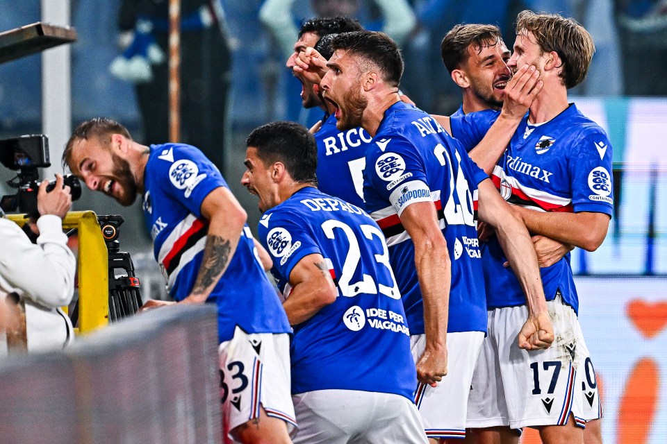 Soccer players celebrating a goal.