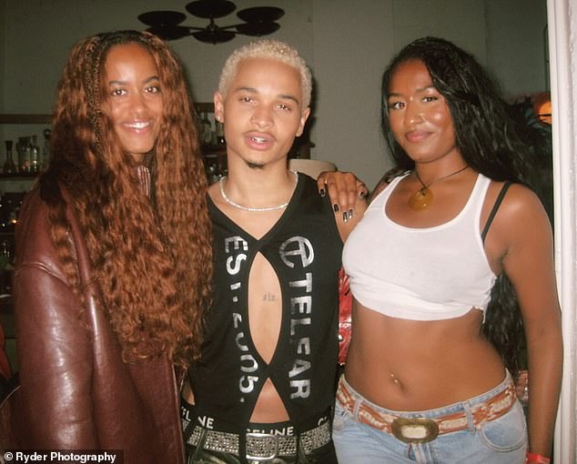 Sasha Obama showed off her toned physique in a cropped white tank as she partied with her sister Malia Obama at Destin Conrad's listening party
