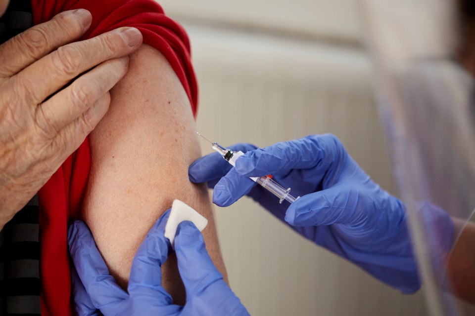 A person receiving a COVID-19 vaccination.