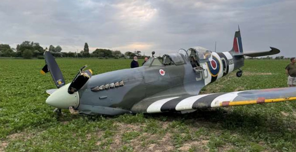 World War II Spitfire crash-landed in a field.