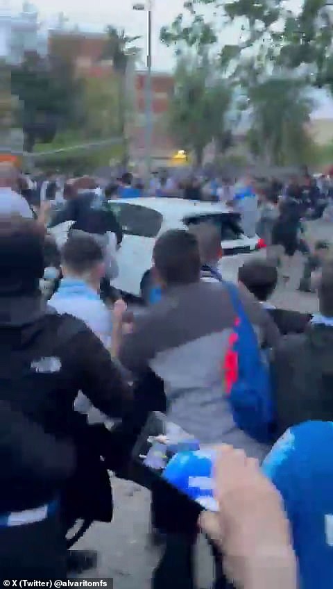 Horrifying footage captured the moment a car ploughed into footballs fans outside a stadium in Barcelona