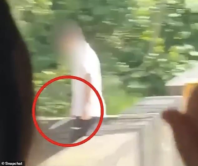 The youngster was to have walked down a set of steps with the weapon as horrified teachers and students watched on yesterday
