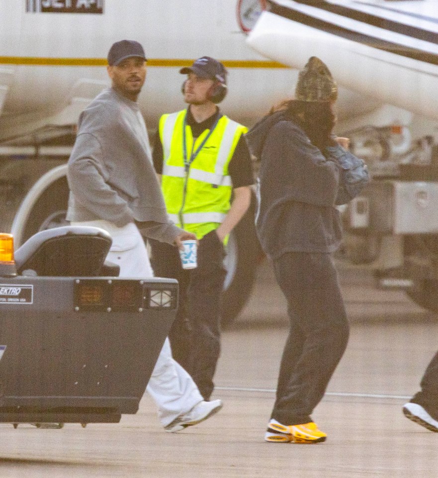 Chris Brown and Diamond Brown arriving at Manchester Airport.