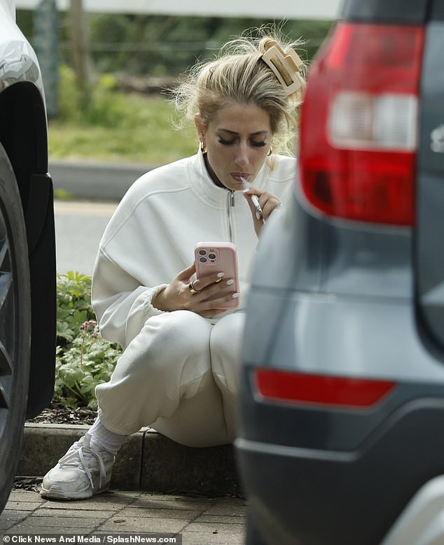 A visibly emotional Stacey Solomon paused for a welcome cigarette break as she left her local veterinary practice with family dog Teddy on Wednesday