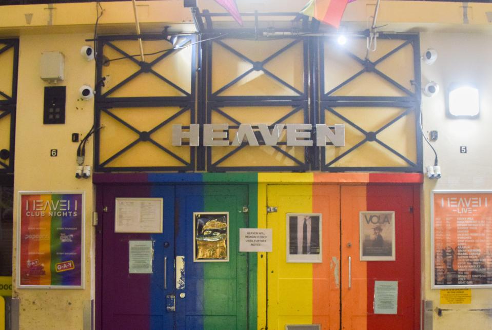 Exterior view of Heaven nightclub, with rainbow-striped doors and a sign reading "HEAVEN."