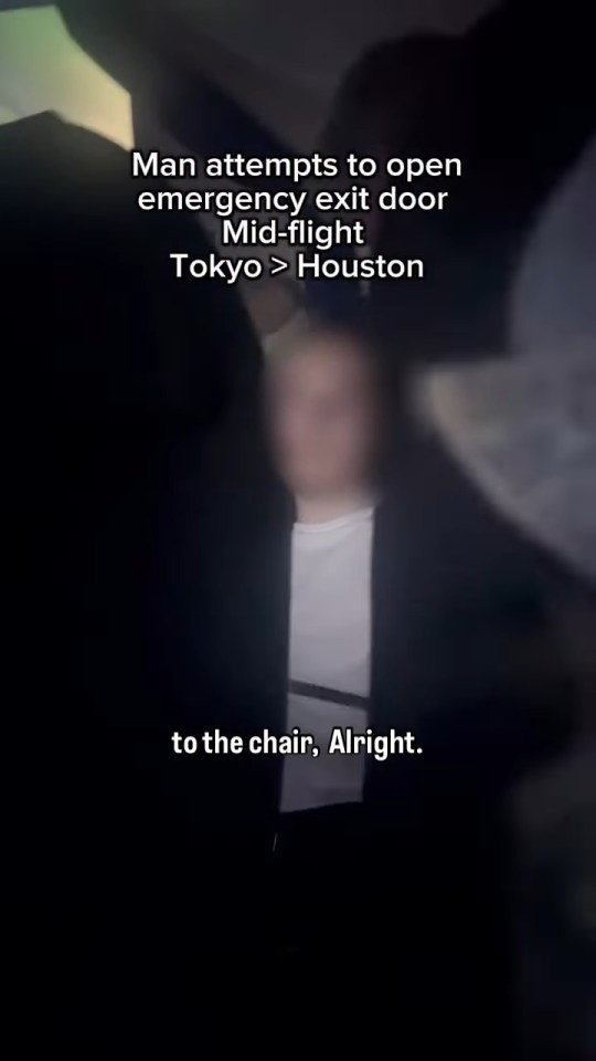 Video of a man attempting to open an emergency exit door mid-flight from Tokyo to Houston.