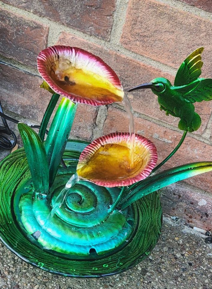 Metal hummingbird garden fountain.