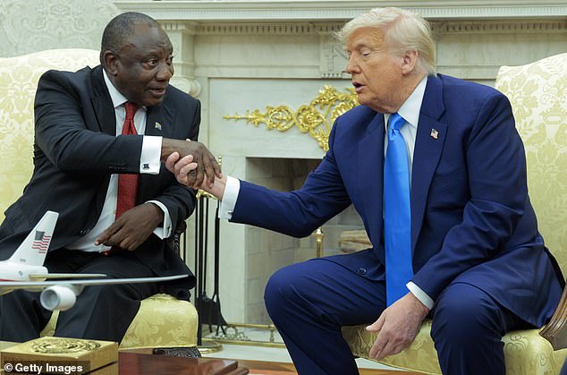 South African President Cyril Ramaphosa is seen shaking hands with Donald Trump in the Oval Office