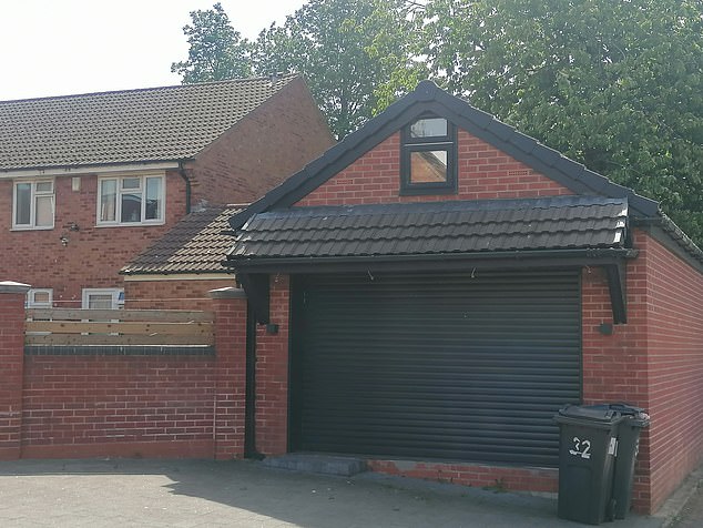Images show what the 'garage' now looks like, with the front door replaced with a traditional garage door