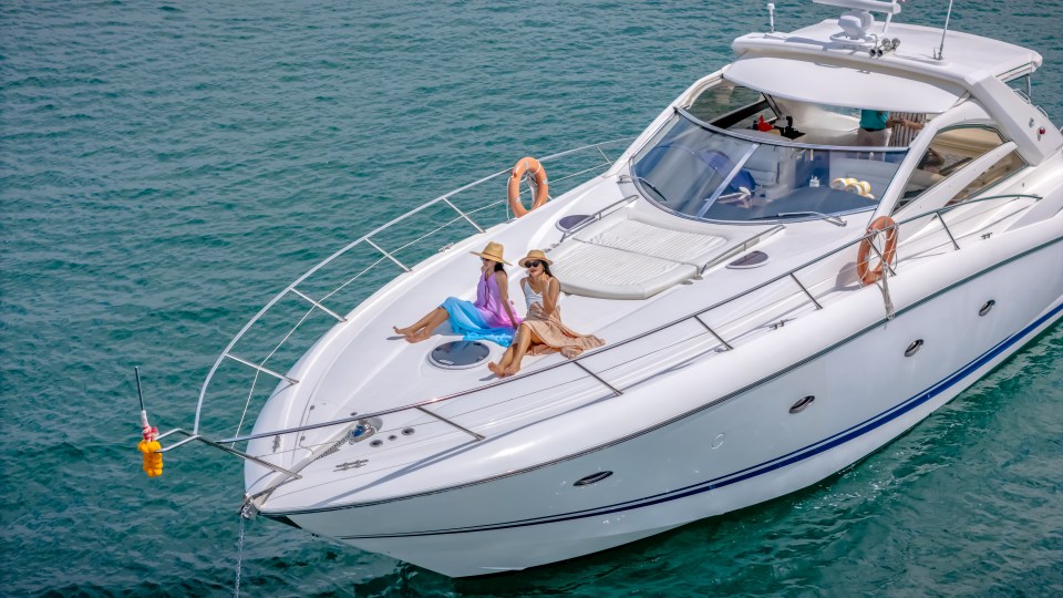 Two women relaxing on a yacht.