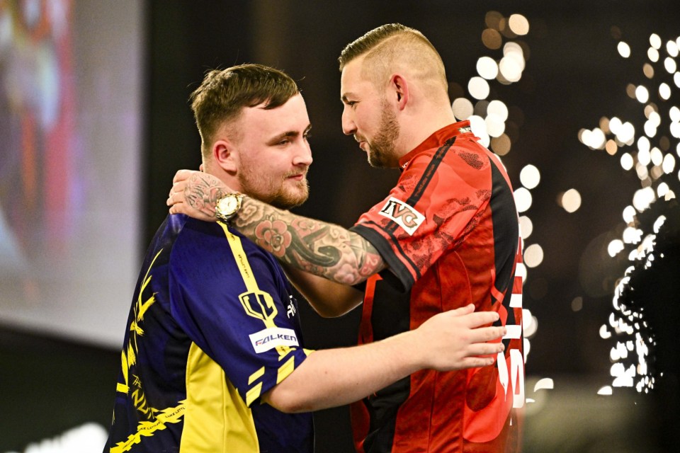 Mandatory Credit: Photo by Godfrey Pitt/Action Plus/REX/Shutterstock (15057550ds) Nathan Aspinall congratulates his opponent Luke Littler on his win in the quarter final; 1st January 2025, Alexandra Palace, London, England; 2024/25 PDC Paddy Power World Darts Championships Day 14. PDC World Darts Championship, Day 14, London, UK - 01 Jan 2025