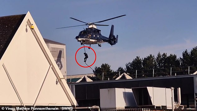 Tesco shoppers were left stunned on Monday after sporting black-clad figures abseiling at speed from several helicopters - in an apparent military exercise in Baguley, Manchester