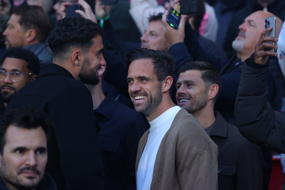 Max Kilman, Danny Ings, and Aaron Cresswell of West Ham United watching a match.