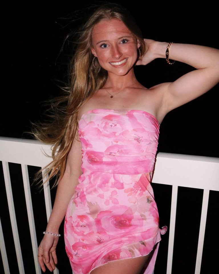 Woman in pink floral dress.