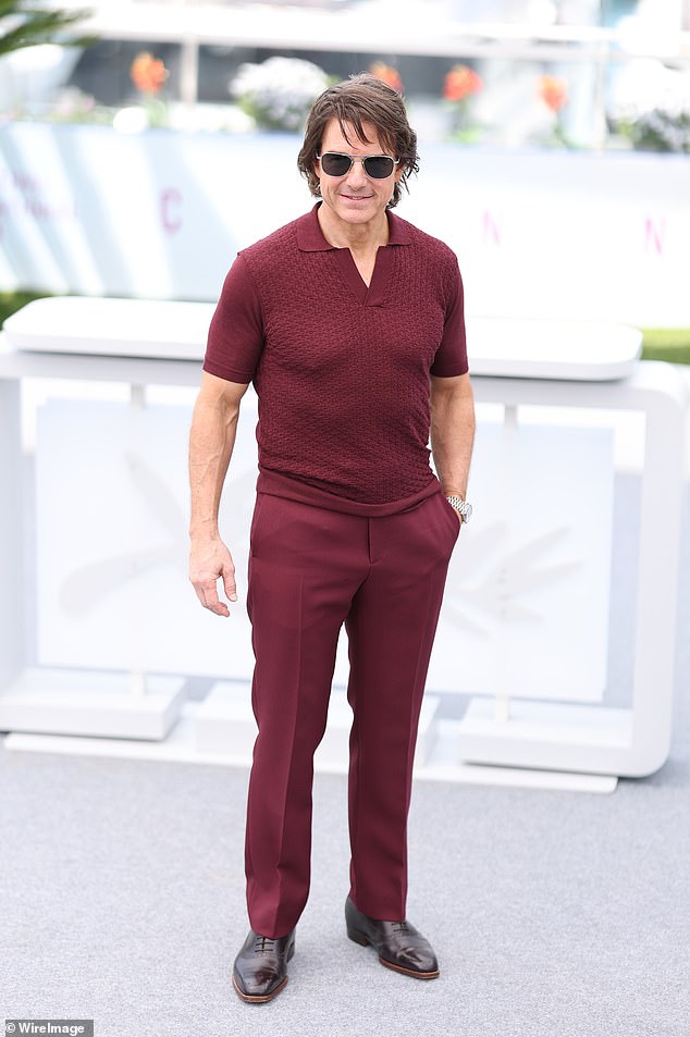 Tom meanwhile stuck to his tried and tested look of biceps-baring polo shirt and matching trousers in a deep red colour