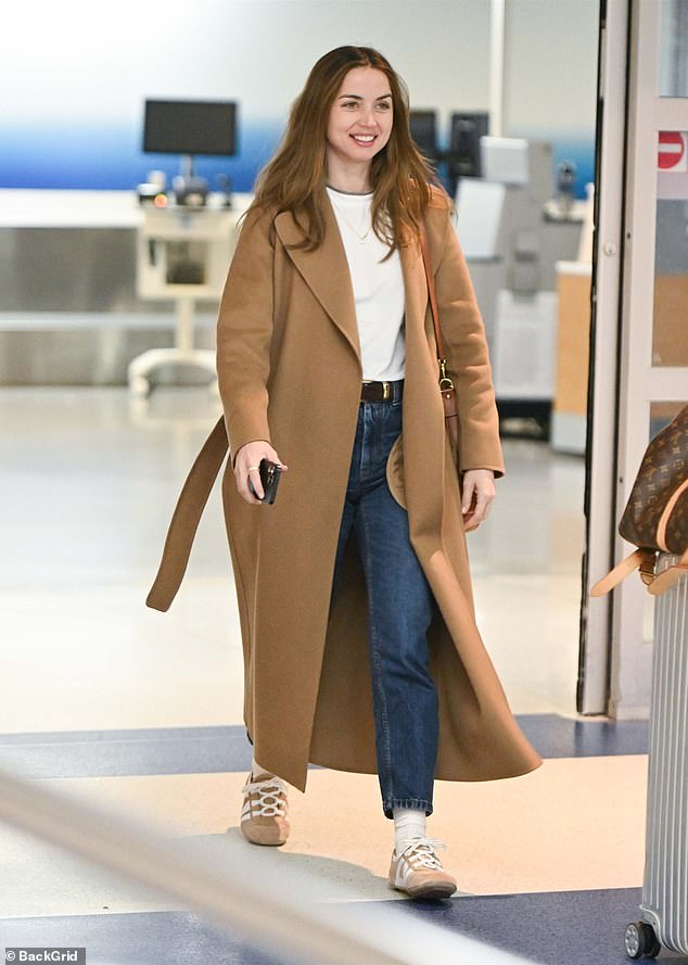 His current flame, Ana De Armas, 37, was spotted arriving in the U.S. on Saturday, looking happy and healthy with a huge smile, despite coming without the movie star by her side