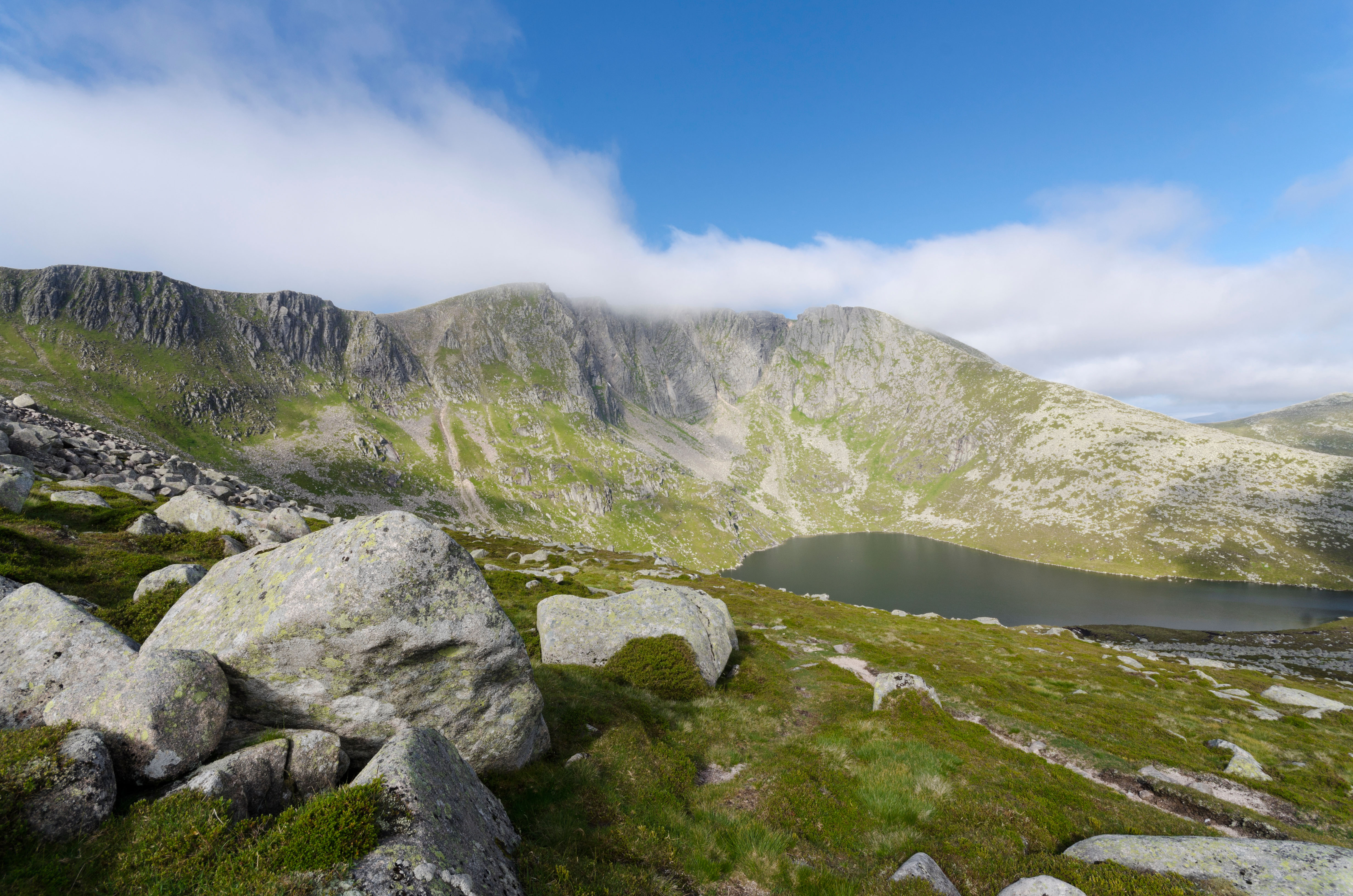 Lochnagar mountain with loch and mist.