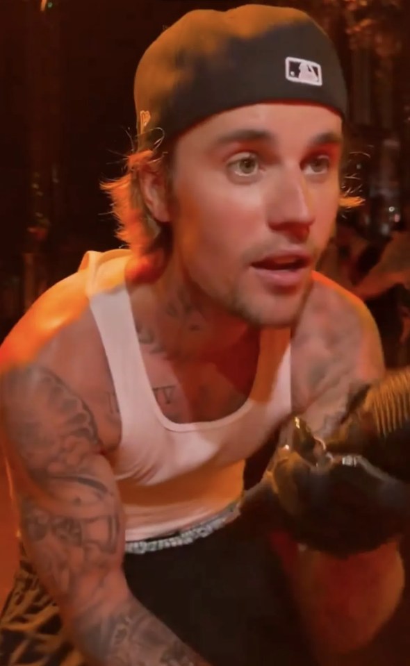 Justin Bieber performing on stage.