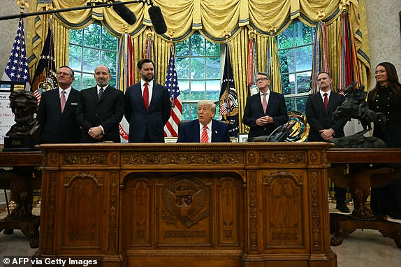 US President Donald Trump makes a trade announcement as US Secretary of Commerce Howard Lutnick (2L), US Vice President JD Vance (3L), British ambassador to the United States Peter Mandelson (3R),  US Trade Representative Jamieson Greer (3R) and US Secretary of Agriculture Brooke Rollins (R) look on in the Oval Office of the White House in Washington, DC, on May 8, 2025. US President Donald Trump on announced a "full and comprehensive" trade agreement with Britain, which would be the first such deal since he launched his global tariffs blitz. (Photo by Jim WATSON / AFP) (Photo by JIM WATSON/AFP via Getty Images)