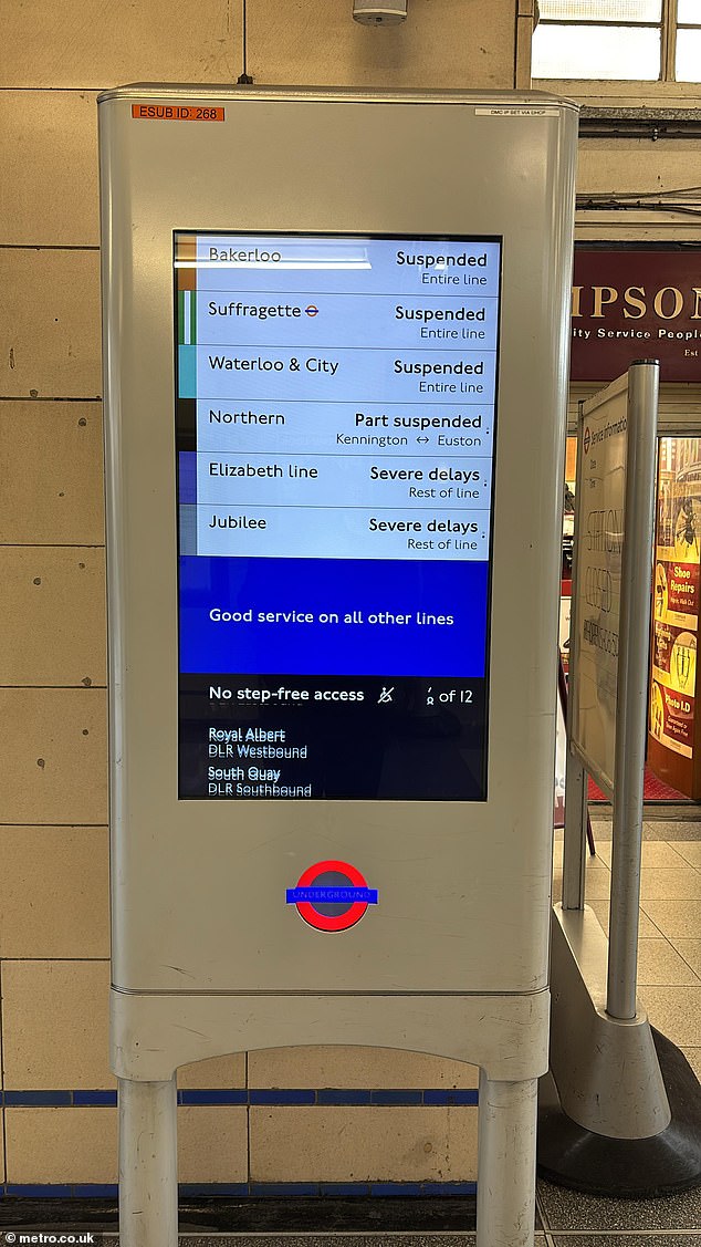 Signage on an information board at High Street Kensington station in West London today