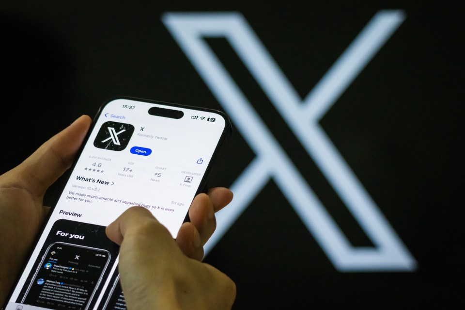 Person using the X app (formerly Twitter) on a smartphone.