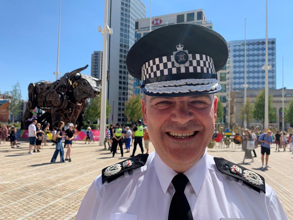 West Midlands Police chief constable Sir David Thompson smiling for a photo.