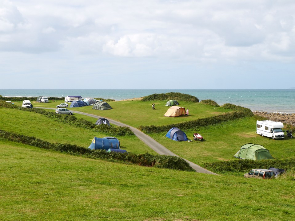 Shell Island campsite in North Wales with tents and campervans.