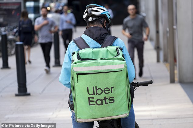 With delivery apps including UberEats, Just Eat and Deliveroo, Brits now have myriad of ways of satiating their cravings - all at the touch of a button (stock image)