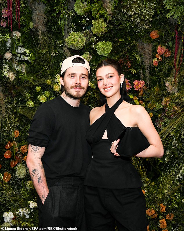 The pair looked to enjoy their evening out despite their fears there may be no way back for them and son Brooklyn after he declared he 'would always choose' wife Nicola Peltz