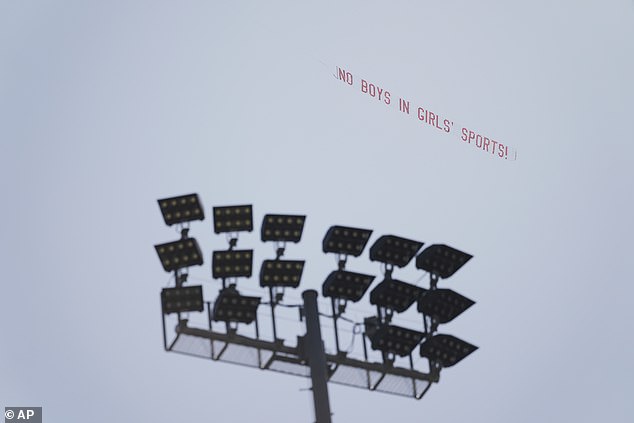 A banner protesting a transgender athlete's participation in the California high school track-and-field championships was flown over the meet in Clovis Friday