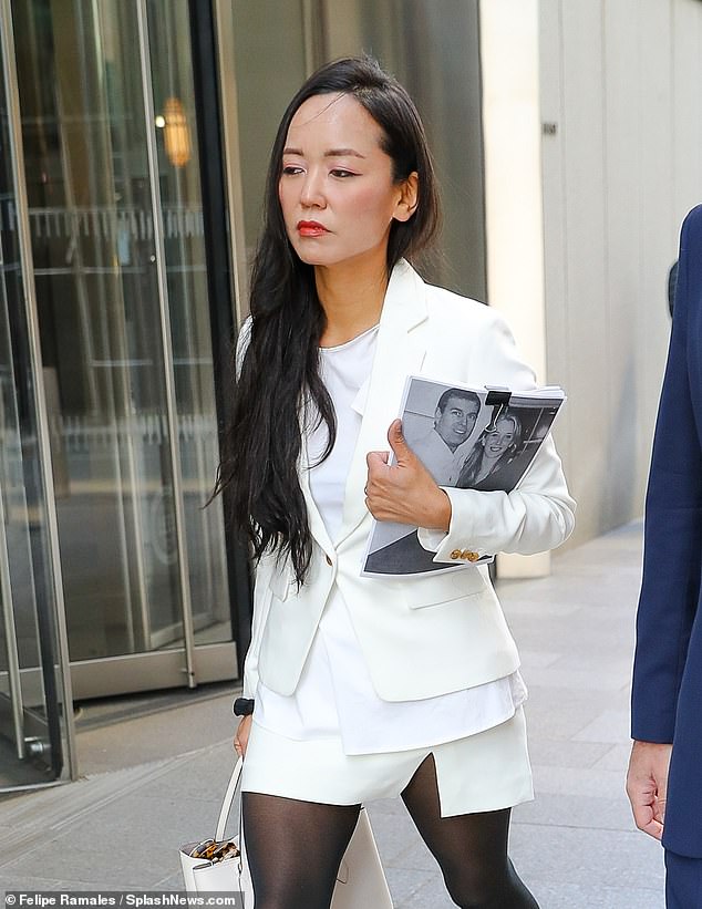 Ms Giuffre was being sued by artist Rina Oh (pictured) for falsely describing her as a girlfriend of Epstein and one of the convicted sex offender's recruiters