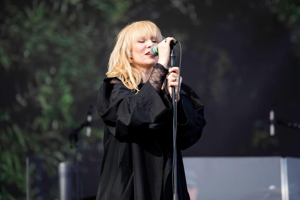 Natasha Bedingfield performing at a music festival.