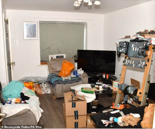 The family living room which, as chilling photographs revealed in court, was being used as a bedroom by the killer