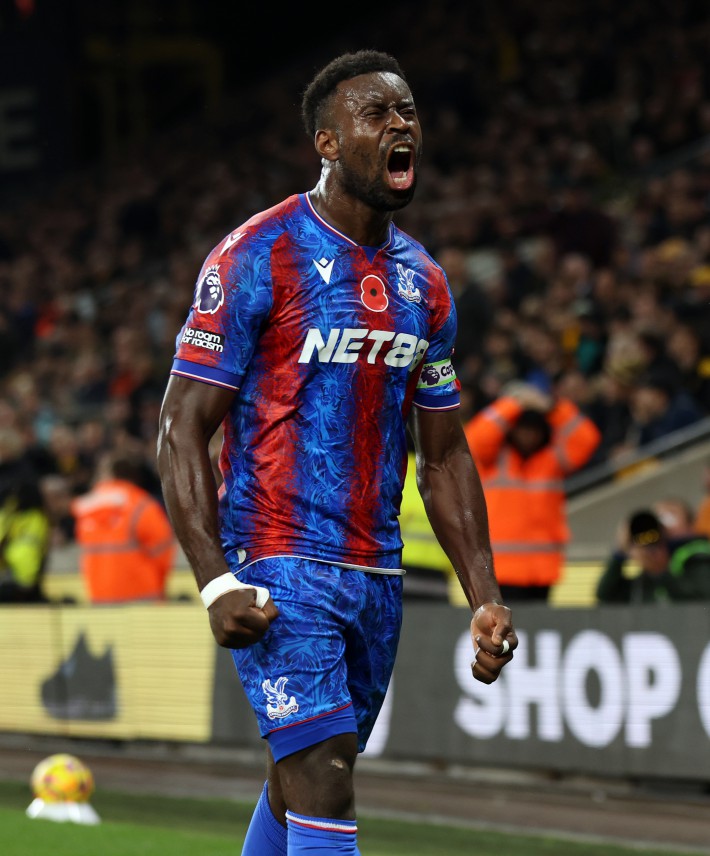 Crystal Palace's Marc Guehi celebrates scoring their side's second goal of the game during the Premier League match at Molineux, Wolverhampton. Picture date: Saturday November 2, 2024. PA Photo. See PA story SOCCER Wolves. Photo credit should read: Barrington Coombs/PA Wire. RESTRICTIONS: EDITORIAL USE ONLY No use with unauthorised audio, video, data, fixture lists, club/league logos or "live" services. Online in-match use limited to 120 images, no video emulation. No use in betting, games or single club/league/player publications.