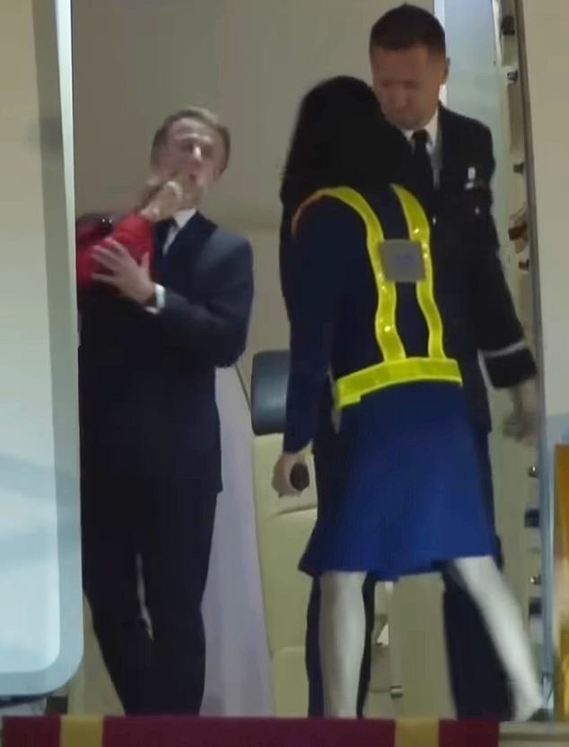 Shocking footage taken on Sunday evening, shows the French President's plane door opening to reveal him before his wife Brigitte places both hands on her husband's face and gives it a shove