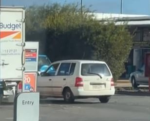 The driver of the white hatchback rammed the blue SUV up to 10 times (pictured)