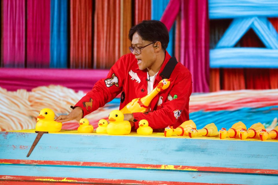 Papi on Britain's Got Talent playing with rubber ducks and chickens.