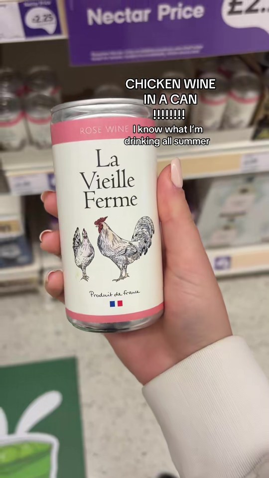 Hand holding a can of La Vieille Ferme rosé wine.