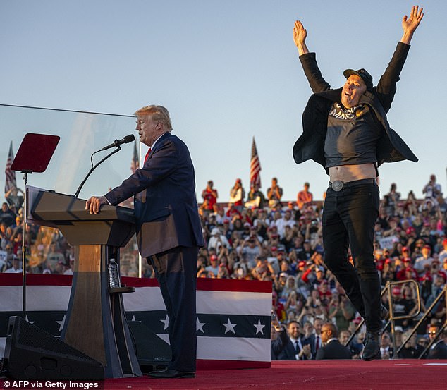 Musk dances around the stage as Trump speaks at a campaign rally last year
