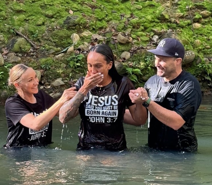 Baptism in a river.