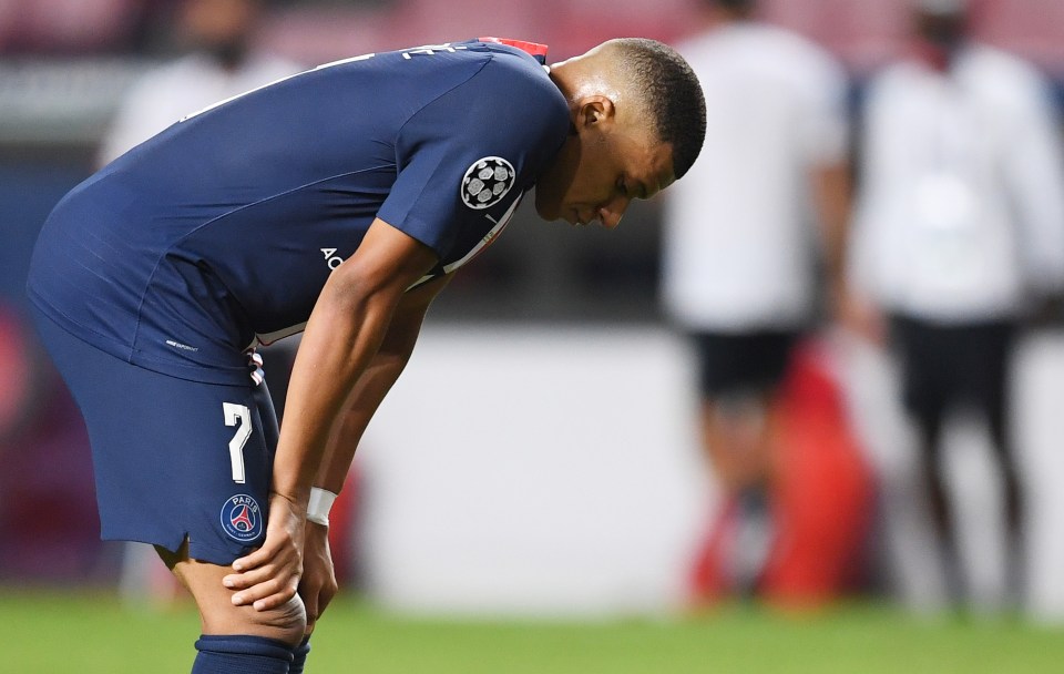 Kylian Mbappé of PSG looking down after a soccer game.