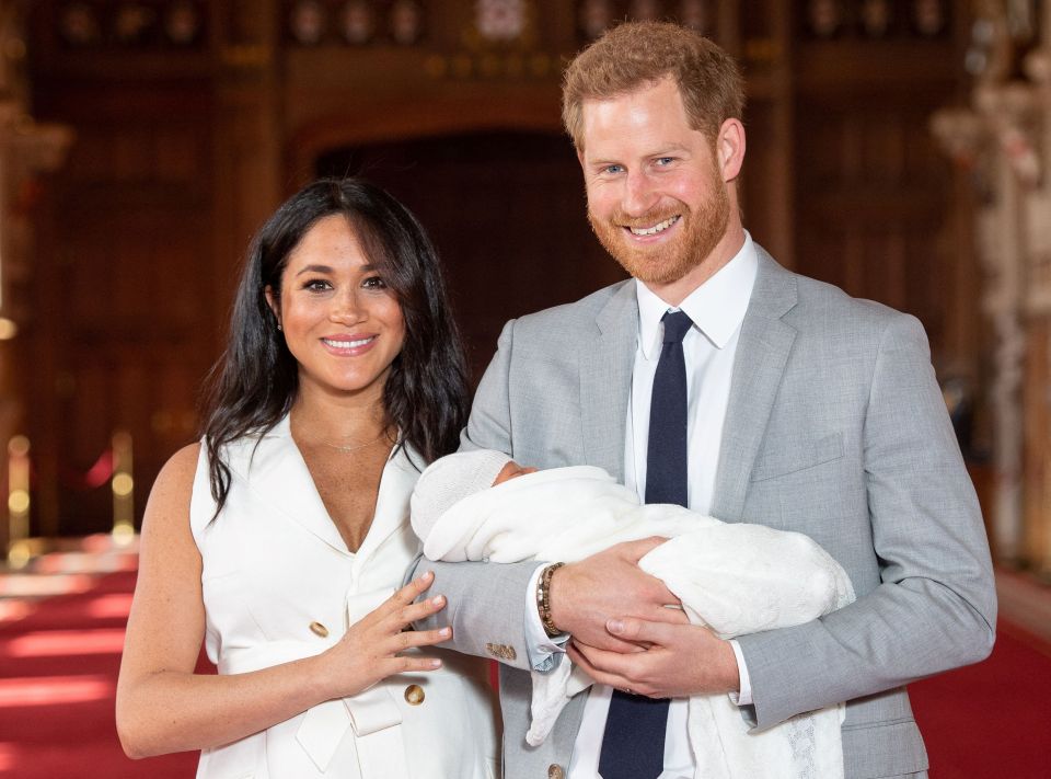 Prince Harry and Meghan, Duchess of Sussex, posing with their newborn son.